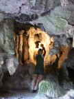 Sim illuminates a corner of the cave